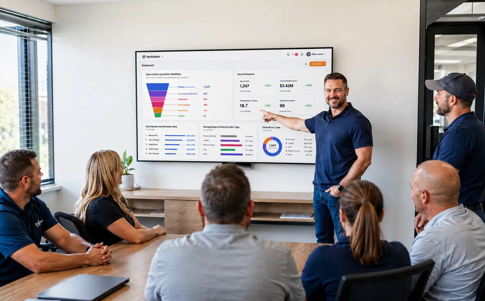A manager presenting to a team in a conference room